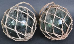 PAIR OF EARLY 20TH CENTURY PRESSED GREEN GLASS WITCHES BALLS