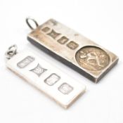 TWO HALLMARKED SILVER INGOT PENDANTS