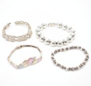 FOUR VINTAGE SILVER BRACELETS