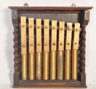 AN EARLY 20TH CENTURY OAK & BRASS PRESENTATION XYLOPHONE