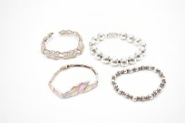 FOUR VINTAGE SILVER BRACELETS