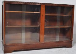 A RETRO CIRCA 1980S OAK BOOKCASE WITH TWIN GLAZED DOORS