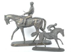 TWO VINTAGE BRONZE EFFECT JOCKEY HORSE RIDER STATUES
