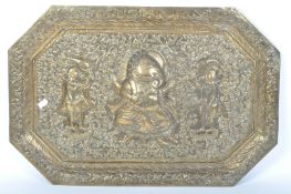 AN INDIAN EMBOSSED BRASS WALL HANGING / TRAY