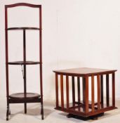 A MAHOGANY THREE TIERED CAKE STAND W/ REVOLVING BOOKCASE