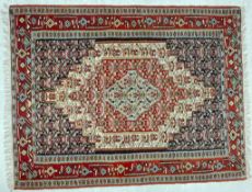 AN EARLY 20TH CENTURY KURDISH ISLAMIC SENNEH KILIM FLOOR RUG