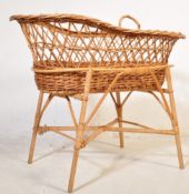 A RETRO VINTAGE CANED WICKER BAMBOO MOSES BASKET