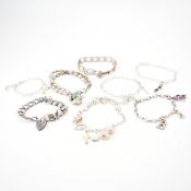 GROUP OF VINTAGE SILVER CHARM BRACELETS
