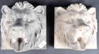 TWO EARLY 20TH CENTURY COMPOSITE LION WALL PLAQUES