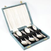 SET OF SIX SILVER ROSE HANDLED TEA SPOONS
