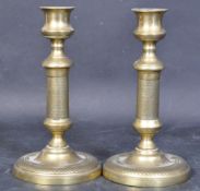 A PAIR OF VICTORIAN BRASS CANDLE STICK HOLDERS
