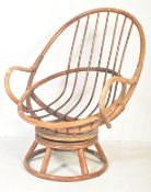 1970S BAMBOO & WICKER SWIVEL ARMCHAIR