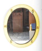 YELLOW PAINTED OVAL FOLK BEVELLED MIRROR