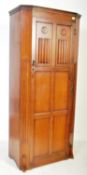 20TH CENTURY JACOBEAN REVIVAL OAK SENTRY HALL WARDROBE