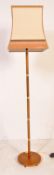 MID 20TH CENTURY TEAK AND BRASS STANDING LAMP