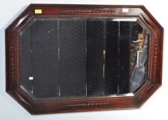 EARLY 20TH CENTURY CARVED OAK BEVELLED MIRROR