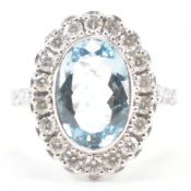 18CT WHITE GOLD AQUAMARINE & DIAMOND HALO RING