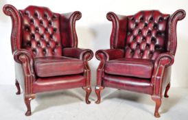PAIR OF CHESTERFIELD OXBLOOD WING BACK ARMCHAIRS