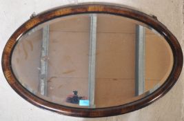 EARLY 20TH CENTURY OVOLU CUSHION WALL MIRROR