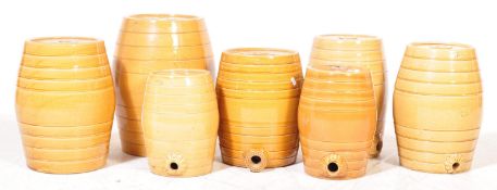 COLLECTION OF SEVEN PRICE BRISTOL FLAGON BARRELS