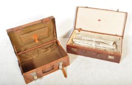 TWO EARLY 20TH CENTURY TAN LEATHER SUITCASES