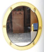 YELLOW PAINTED OVAL FOLK BEVELLED MIRROR