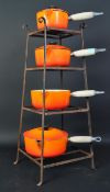 FOUR VINTAGE LE CREUSET SAUCEPANS ON STAND