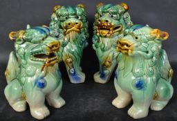 TWO PAIRS OF VINTAGE CERAMIC FU-DOGS IN GREEN GLAZE