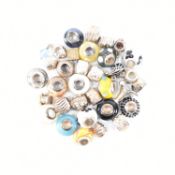 COLLECTION OF SILVER WHITE METAL & GLASS BEAD CHARMS