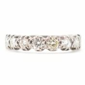 WHITE GOLD & DIAMOND EIGHT STONE HALF HOOP RING