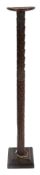 20TH CENTURY TALL UNUSUALLY CARVED PILLAR CANDLE HOLDER