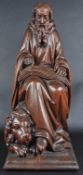 20TH CENTURY CARVED SEATED STATUE OF SAINT JEROME