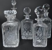 FIVE VINTAGE CUT GLASS DECANTERS - INCLUDING STUART CRYSTAL