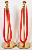 PAIR OF CONTEMPORARY GILT METAL PEDESTAL ROPE BARRIERS