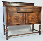 1920'S OAK JACOBEAN REVIVAL BREAKFRONT CREDENZA