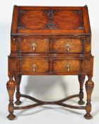 1920S JACOBEAN REVIVAL OAK ARTICULATED WRITING BUREAU DESK