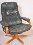 Retro 20th century green leather and bentwood swivel armchair. Raised on splayed leg base with