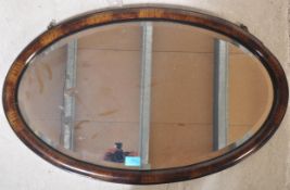 EARLY 20TH CENTURY OVOLU CUSHION WALL MIRROR