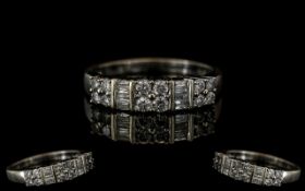 Ladies 14ct White Gold Brilliant and Baguette Cut Diamond Set Dress Ring. The Brilliant Cut and