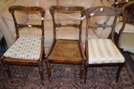 A Regency mahogany dining chair and a pair of similar chairs.