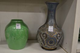 Two Royal Doulton vases, one green glazed with incised decoration, the other decorated in the