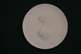 A continental porcelain circular plaque.