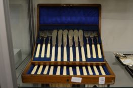A cased set of twelve fish knives and forks.