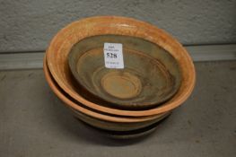 Five Chinese terracotta bowls.