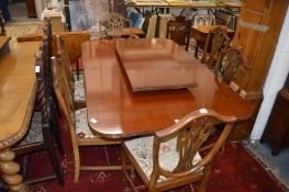 A set of six shield back mahogany dining chairs, one with arms.
