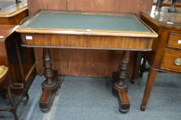 A 19th century mahogany writing table with brass gallery, two frieze drawers on turned column
