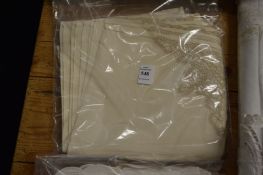 Twelve cream napkins.