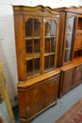 A large yew wood corner cabinet.