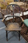 A 19th century ash and elm Windsor armchair.