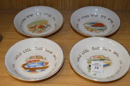 Four small porcelain dishes.